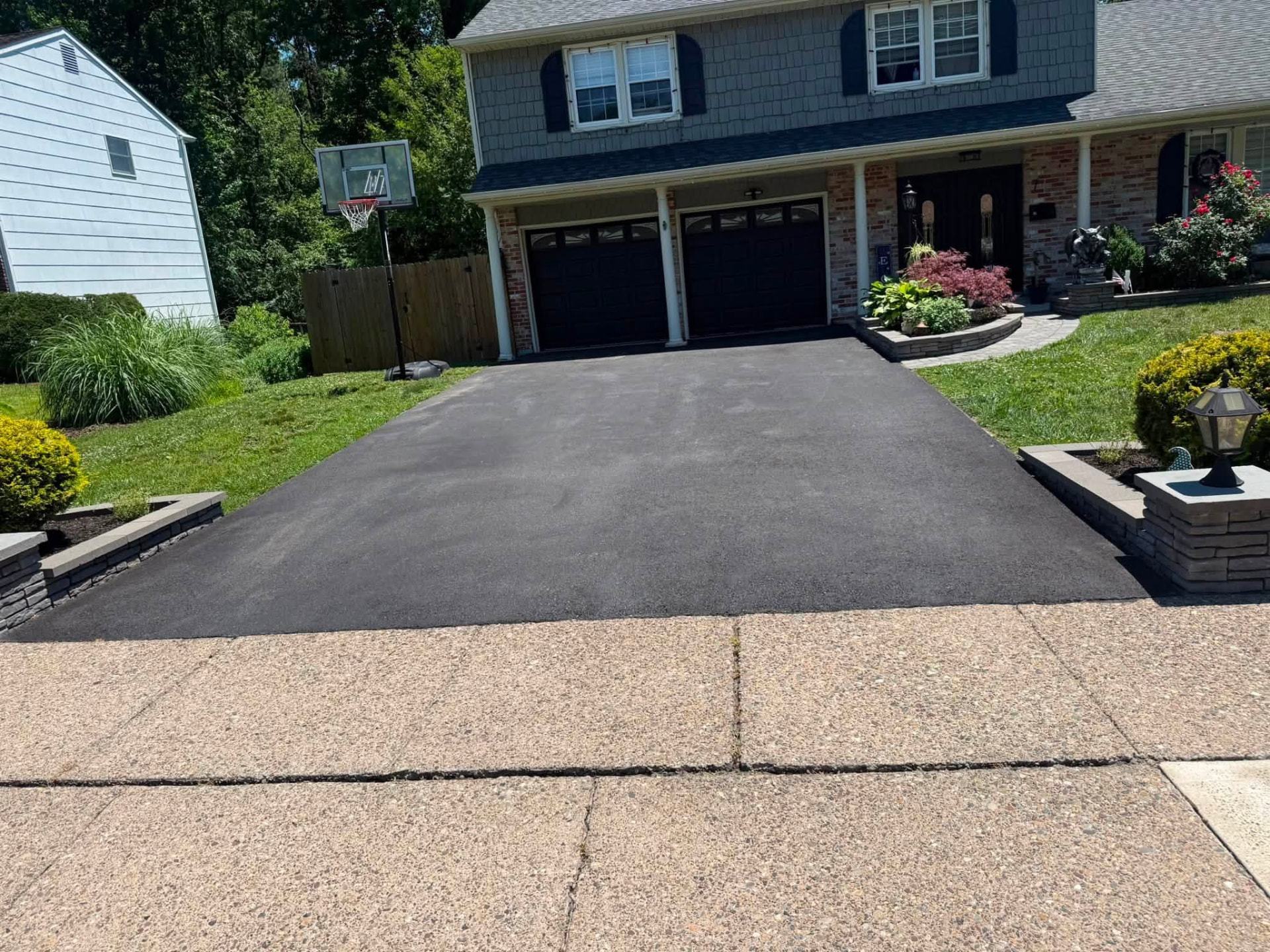 Freshly sealcoated residential asphalt driveway in Philadelphia, PA